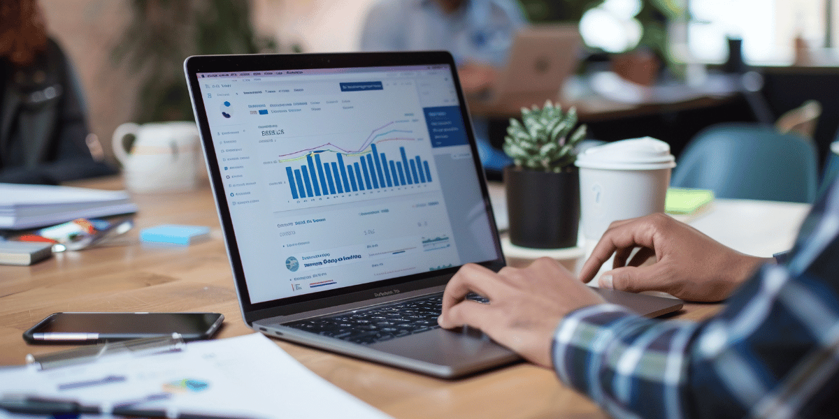 Man working on laptop showing HubSpot sales reports