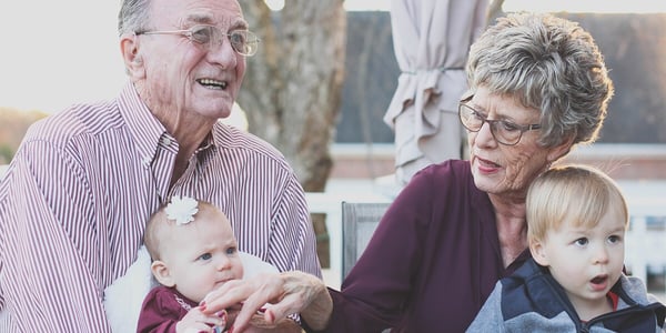 mawmaw and pawpaw holding their grandchildren in south louisiana