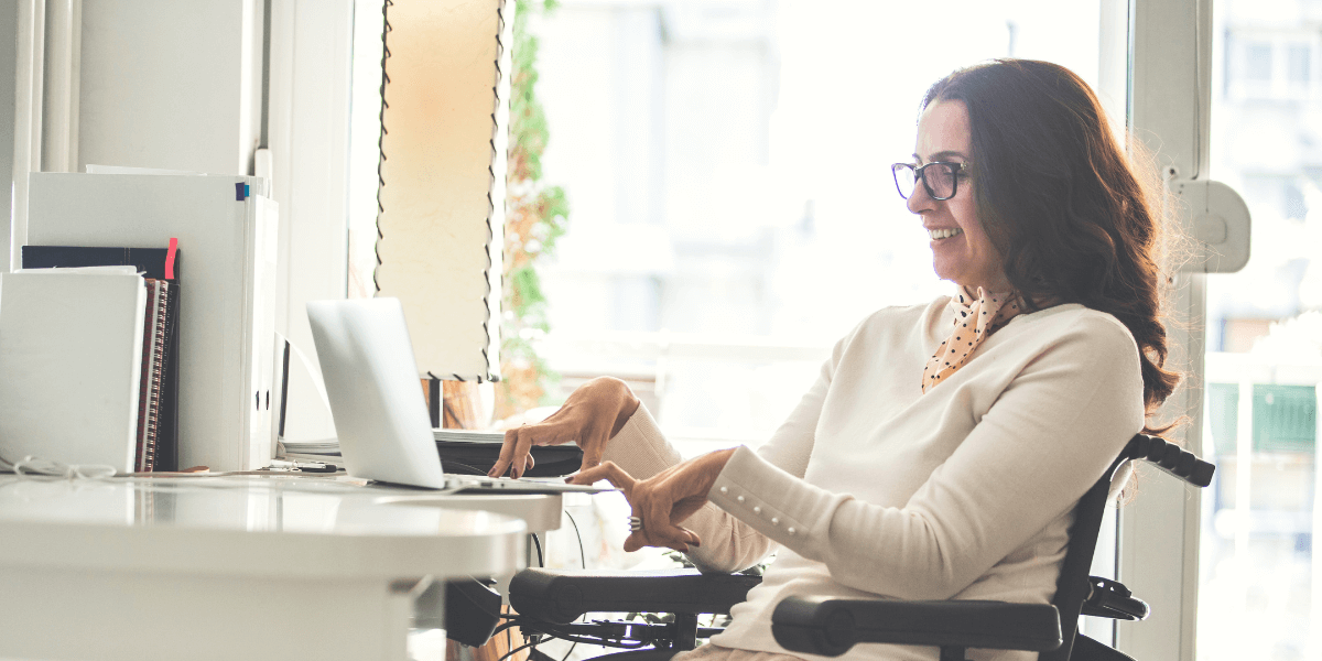 Woman with a physical disability using a laptop.